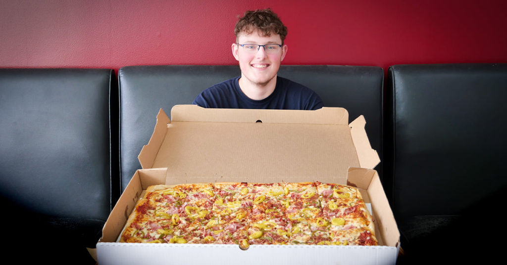 A full, party pizza, nearly three feet in length from Pizza King in Mt. Pleasant, Michigan.